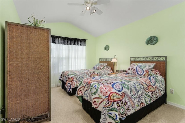 carpeted bedroom featuring ceiling fan and lofted ceiling