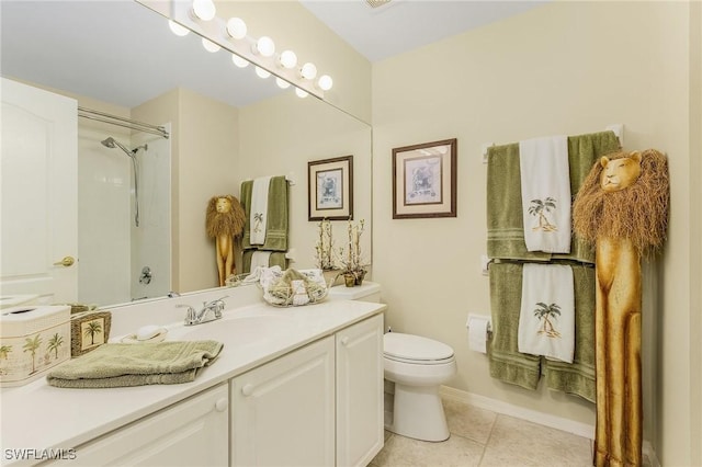 bathroom featuring toilet, vanity, and tile patterned floors