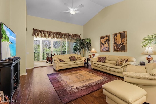 living room featuring ceiling fan, dark wood-type flooring, and high vaulted ceiling