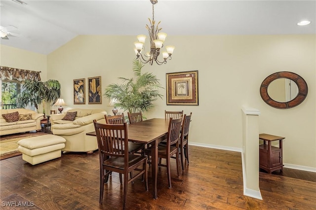 dining space featuring ceiling fan with notable chandelier, lofted ceiling, and dark wood-type flooring