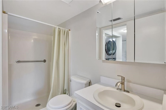 bathroom with vanity, curtained shower, and toilet