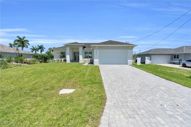 view of front of house with a front yard and a garage