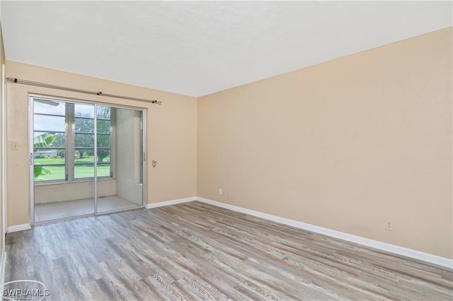 empty room with light hardwood / wood-style floors