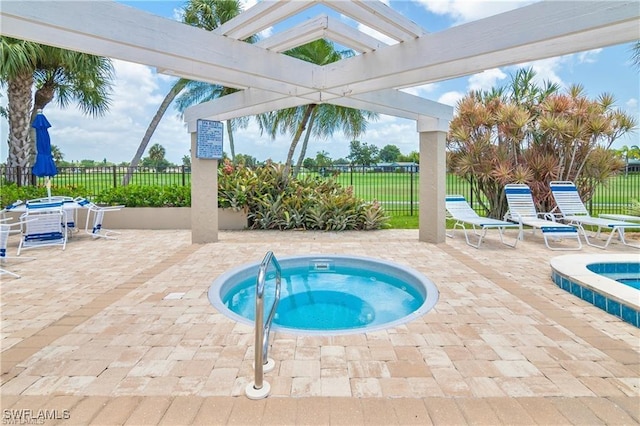 view of pool featuring a patio area and a community hot tub