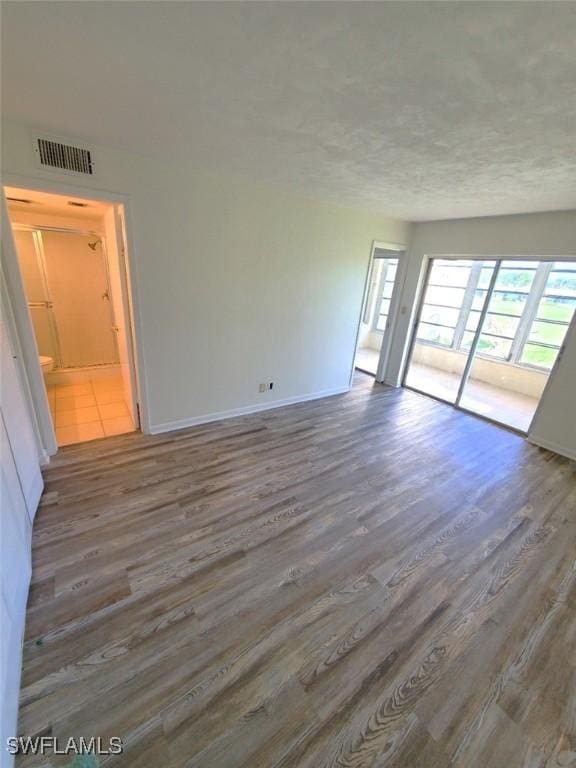 spare room featuring dark hardwood / wood-style floors