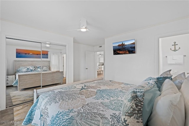 bedroom with ceiling fan and a closet