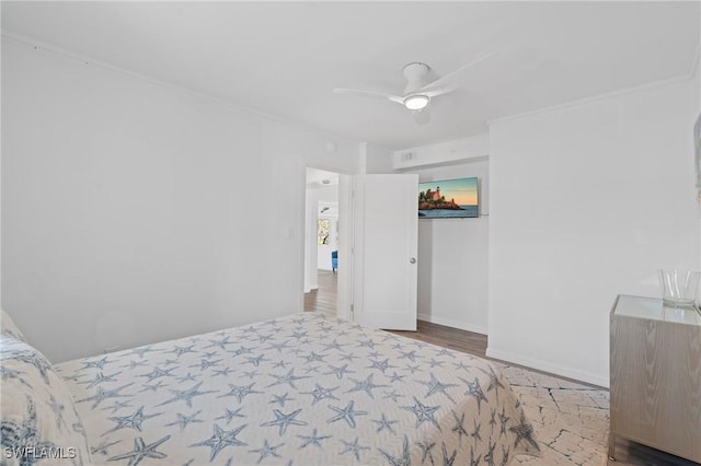 bedroom with hardwood / wood-style flooring and ceiling fan