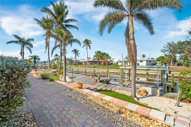 surrounding community featuring a boat dock