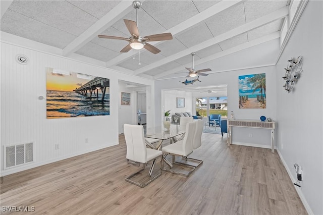 dining area featuring vaulted ceiling with beams, light hardwood / wood-style floors, and ceiling fan