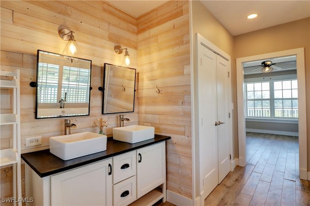 bathroom featuring ceiling fan, vanity, and hardwood / wood-style flooring