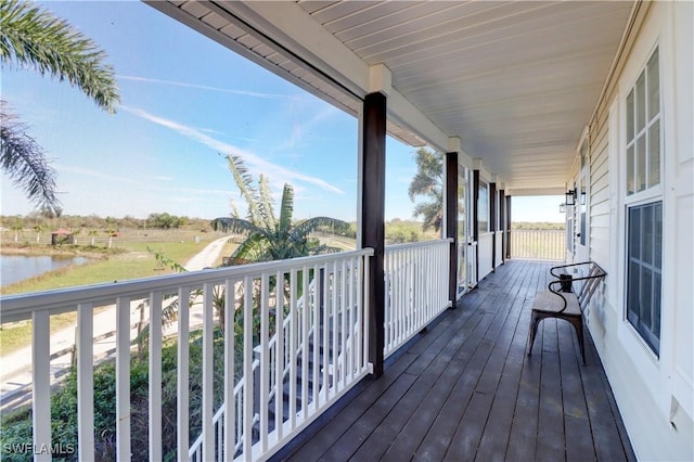 wooden deck with a water view