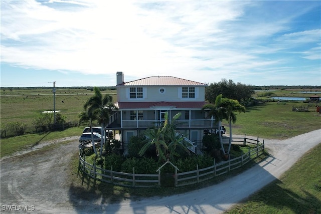 rear view of house with a rural view