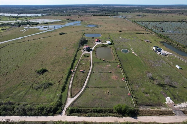 bird's eye view featuring a rural view and a water view