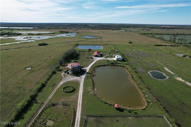 aerial view with a rural view and a water view