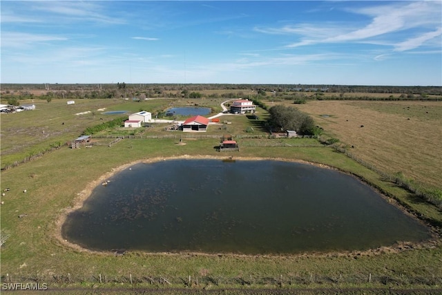 bird's eye view featuring a water view and a rural view