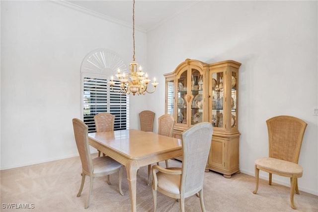 carpeted dining room with crown molding and an inviting chandelier