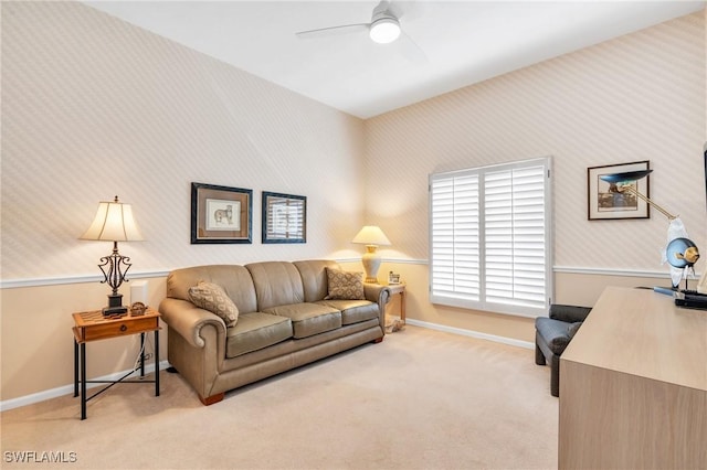 interior space featuring ceiling fan and light colored carpet