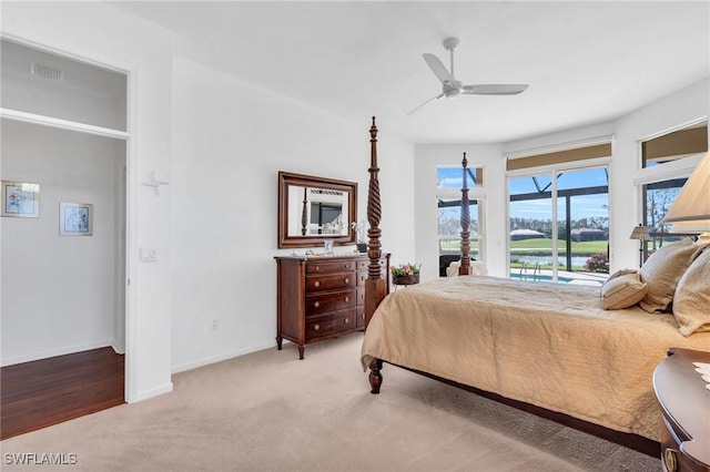 carpeted bedroom with ceiling fan and access to outside