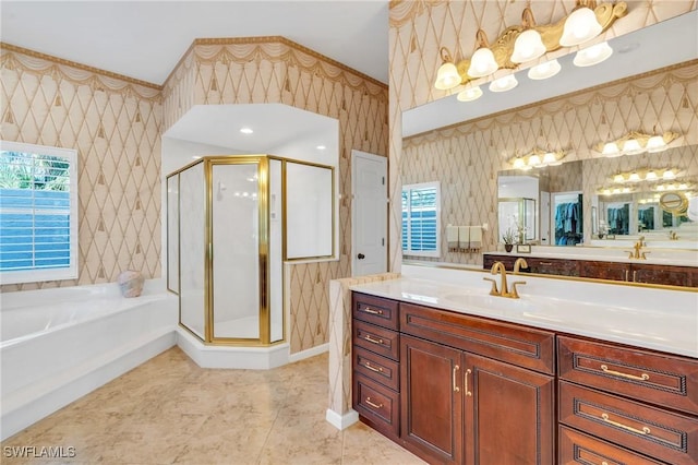 bathroom with shower with separate bathtub, vanity, and plenty of natural light