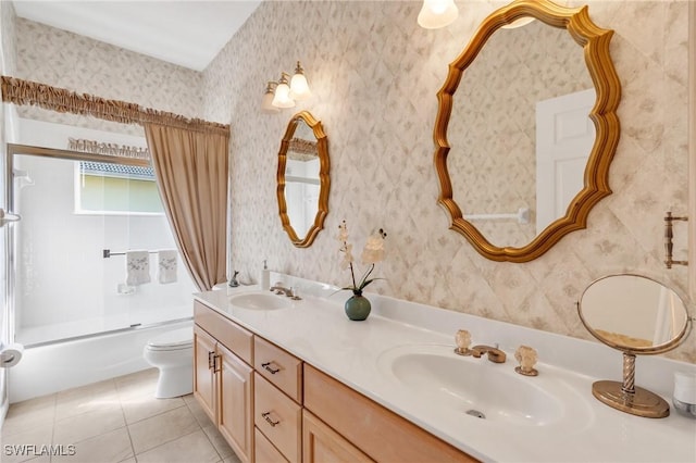 full bathroom featuring washtub / shower combination, vanity, tile patterned floors, and toilet