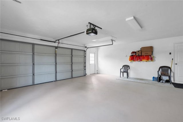 garage featuring a garage door opener