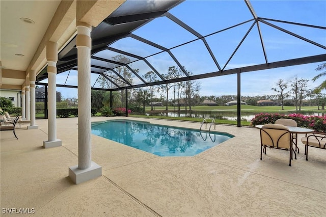 view of swimming pool featuring a water view, glass enclosure, and a patio area