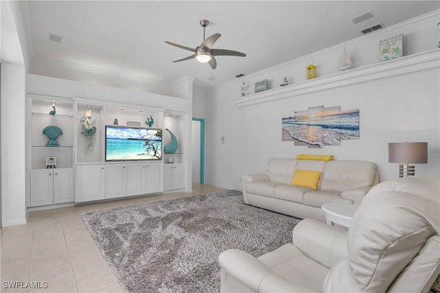 tiled living room featuring ceiling fan and crown molding