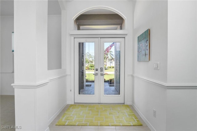 doorway featuring french doors and light tile patterned floors