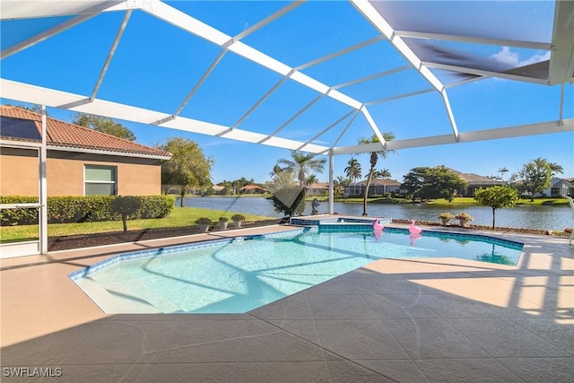 view of pool featuring glass enclosure, a water view, an in ground hot tub, and a patio