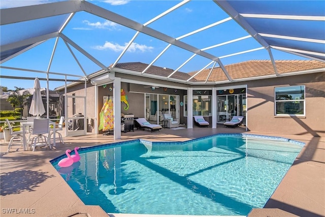 view of pool with a patio, grilling area, and a lanai