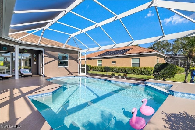 view of pool with a lanai and a patio