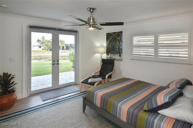 bedroom with ceiling fan, crown molding, access to outside, and french doors