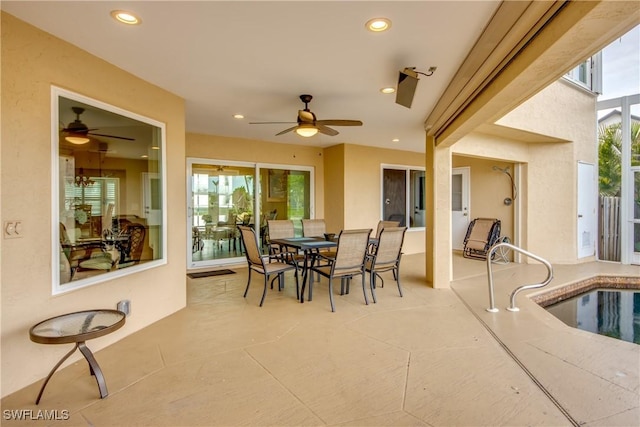 exterior space with ceiling fan