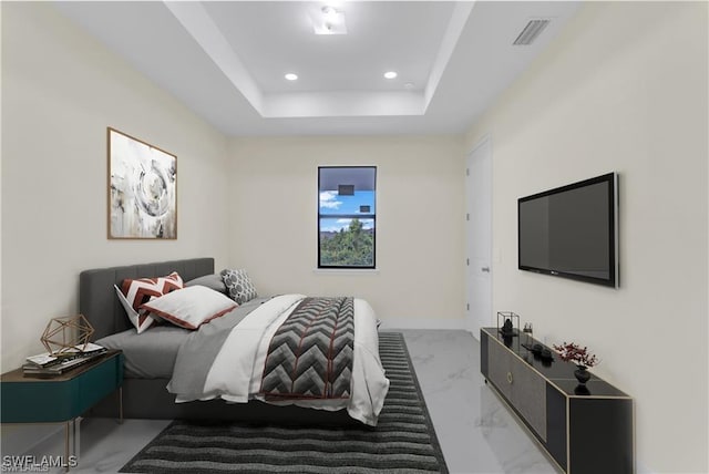 bedroom with a raised ceiling