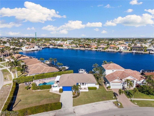 birds eye view of property with a water view