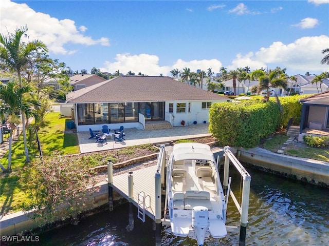 exterior space featuring a patio area and a water view