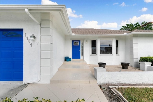 property entrance with a garage