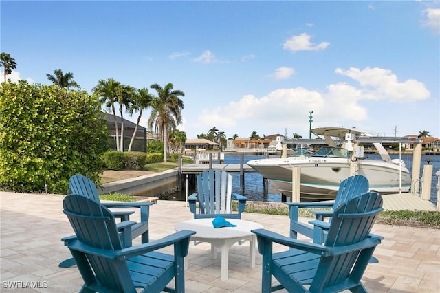 view of patio featuring a dock and a water view