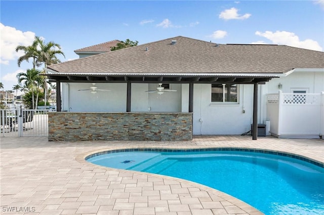 view of pool featuring ceiling fan and a patio