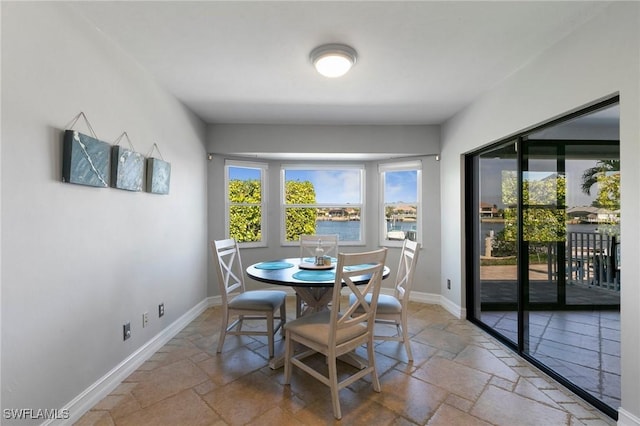 dining room with a water view