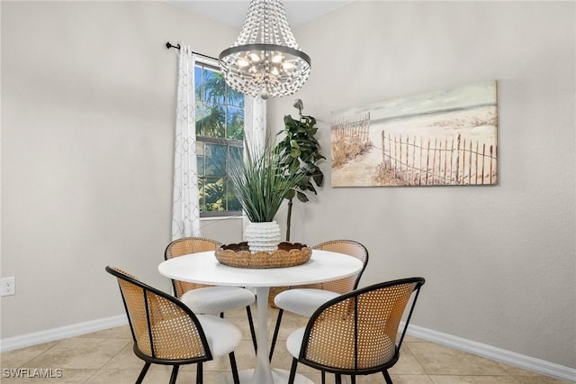 tiled dining space featuring an inviting chandelier