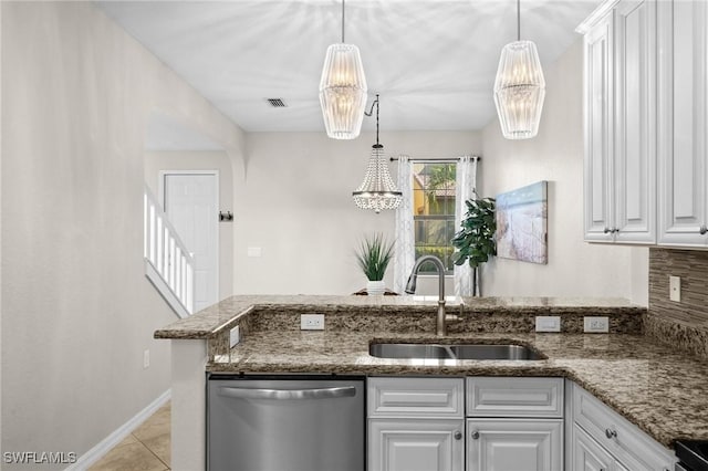 kitchen with dishwasher, white cabinets, decorative light fixtures, and sink