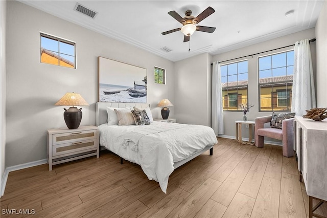 bedroom with ceiling fan and light wood-type flooring