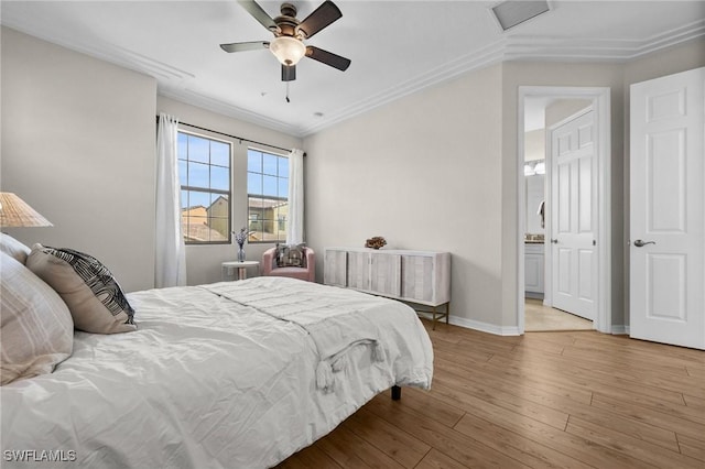 bedroom featuring light wood-type flooring, ceiling fan, and ornamental molding