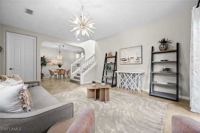 living room featuring a chandelier and light tile patterned flooring