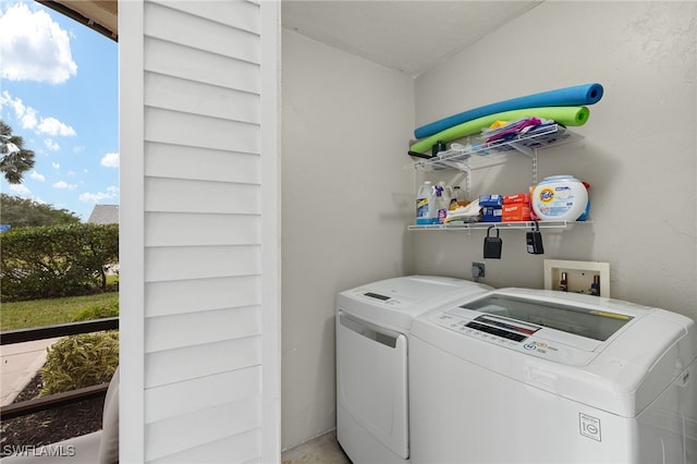 laundry room featuring washer and clothes dryer