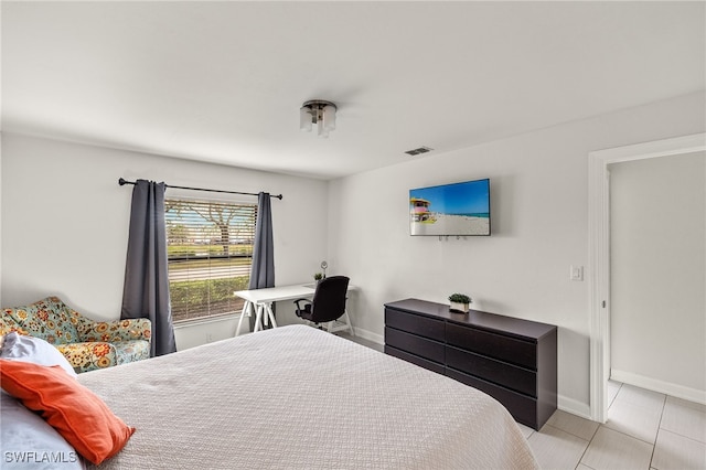 bedroom featuring light tile patterned floors