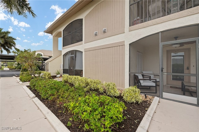 13268 Whitehaven Ln Unit 102, Fort Myers, FL 33966 - view of property exterior with stucco siding