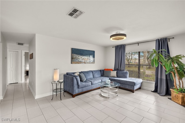 living room with light tile patterned flooring