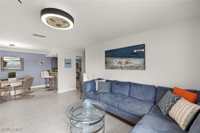 13268 Whitehaven Ln Unit 102, Fort Myers, FL 33966 - living room featuring baseboards and tile patterned flooring